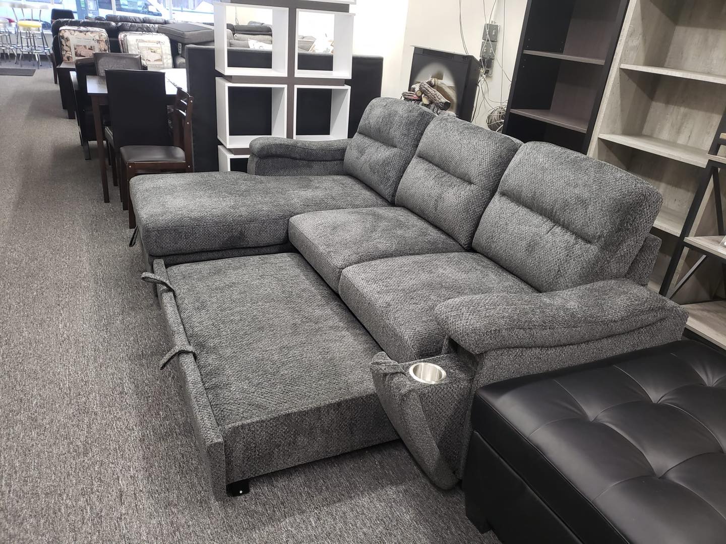 Barstow - Sofa Pull Out Bed with 2 Hidden Cupholders and Reversible Storage Chaise in Charcoal