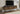 I 2798 - TV STAND - 72"L / BLACK WITH 4 BROWN WOOD-LOOK DOORS